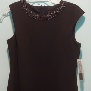Simple black cocktail dress with beaded neck embellishments